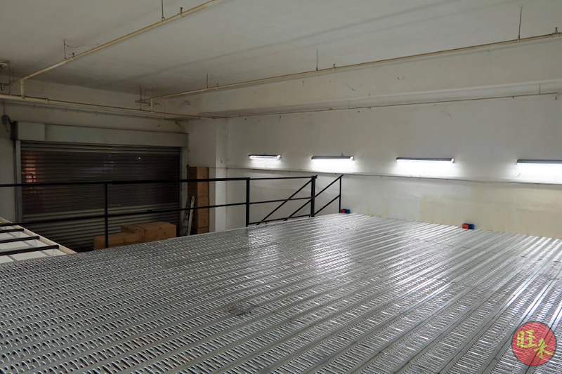 Wide view of the empty mezzanine deck with perforated steel flooring and black railing - V6000 Racking - V6-7 | Wong Lye Racking, Singapore Racking Manufacturer