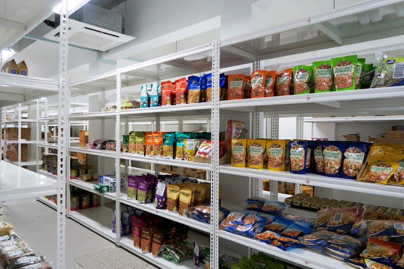 White boltless shelving stocked with bagged snacks and packaged food - Boltless Racking - B6 | Wong Lye Racking, Singapore Racking Manufacturer