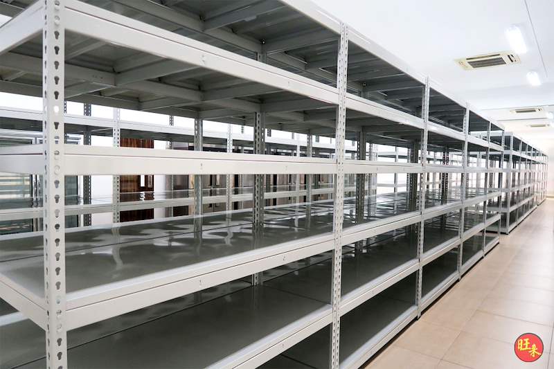 Rows of boltless shelving with steel shelves along the tiled room, all empty - Boltless Racking - B5 | Wong Lye Racking, Singapore Racking Manufacturer