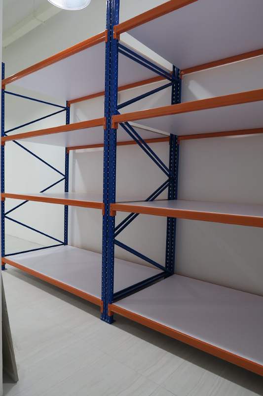 Side view of the long-span racking bay showing blue upright bracing and orange beams - Boltless Racking - B3 | Wong Lye Racking, Singapore Racking Manufacturer