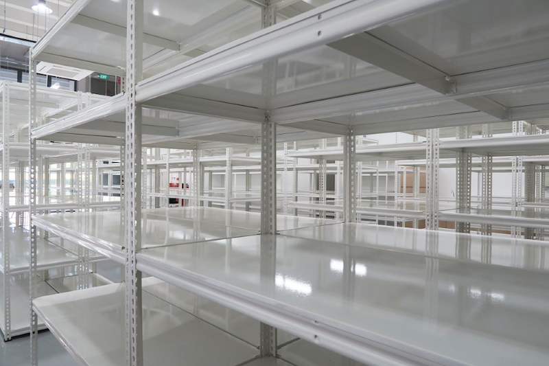 White boltless shelving rows with steel shelf panels, viewed along the top levels - Boltless Racking - B8 | Wong Lye Racking, Singapore Racking Manufacturer