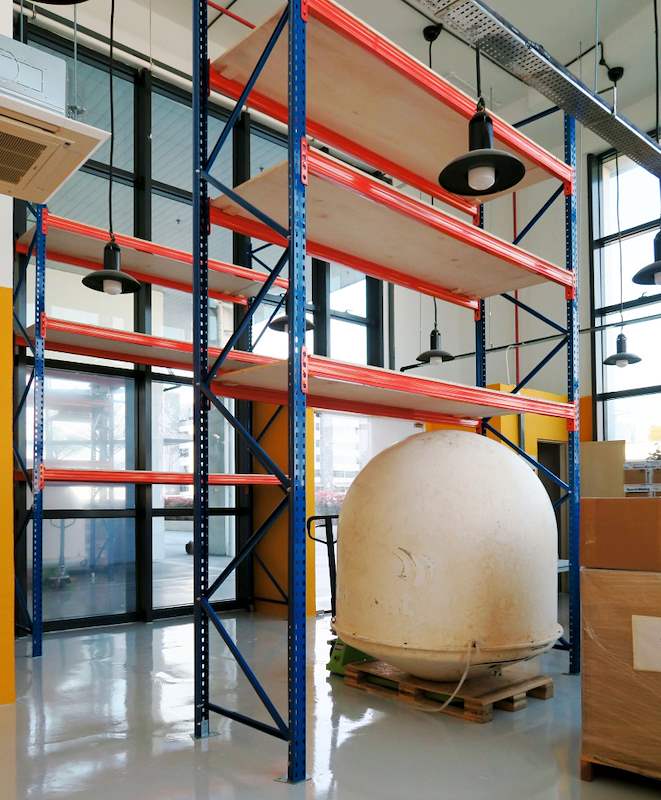 The Pallet Is the Part Nobody Inspects: What Damaged Pallets Do to Your Racking