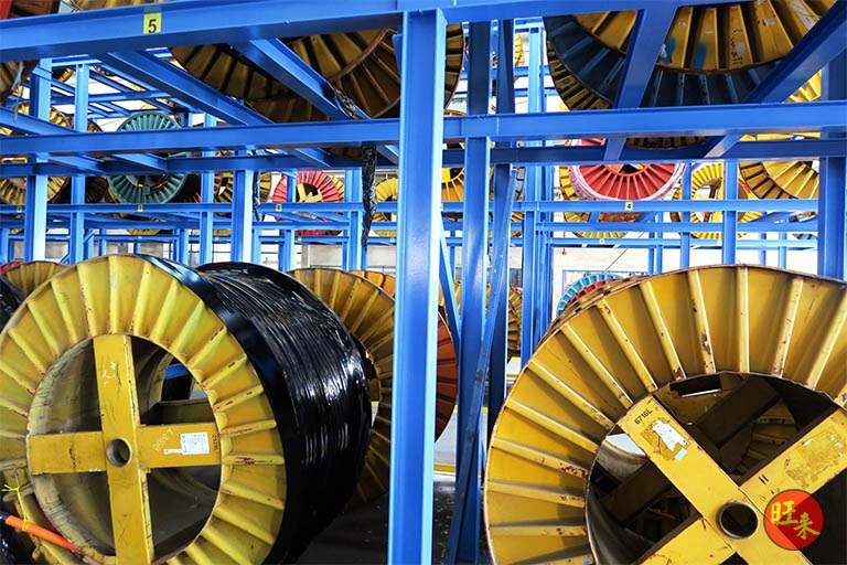 Cable drums seated between the blue steel uprights and beams of the V10000 racking - V10000 Racking - V10-1 | Wong Lye Racking, Singapore Racking Manufacturer