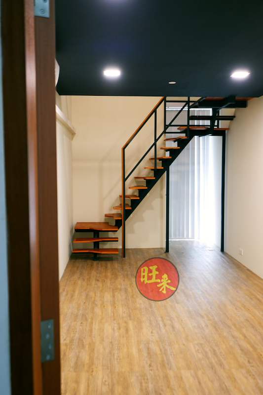 Loft mezzanine and open-tread staircase in a timber-floored unit, viewed from the entrance - V5000 Racking - V5-26 | Wong Lye Racking, Singapore Racking Manufacturer