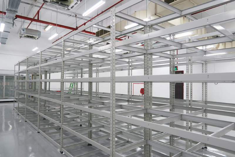 Close view of beige boltless shelving with slotted uprights and steel shelf panels - Boltless Racking - B7 | Wong Lye Racking, Singapore Racking Manufacturer