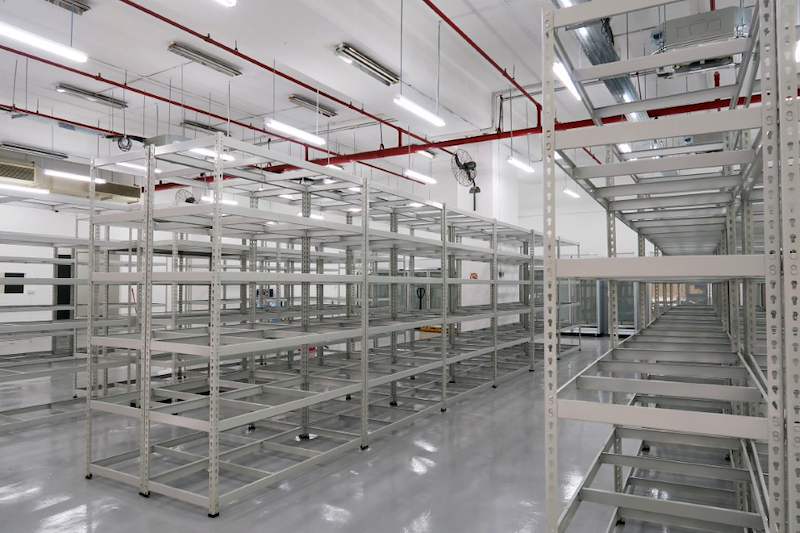 Boltless shelving rows with slotted uprights, viewed from the corner of the unit - Boltless Racking - B7 | Wong Lye Racking, Singapore Racking Manufacturer
