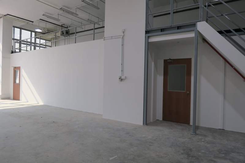 Before: the same empty unit with a steel column and doorway before the mezzanine and racking were installed - V5000 Racking - V5-19 | Wong Lye Racking, Singapore Racking Manufacturer