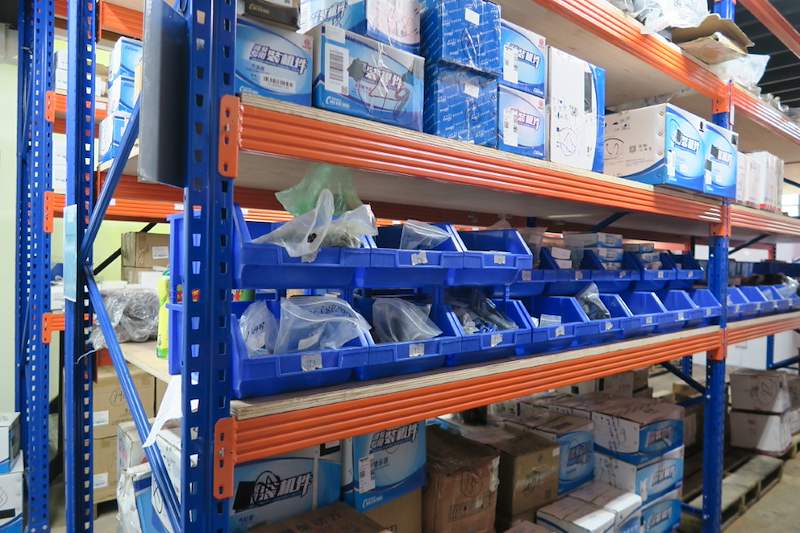 Blue uprights and orange beams with timber decking holding parts bins and cartons - V5000 Racking - V5-8 | Wong Lye Racking, Singapore Racking Manufacturer