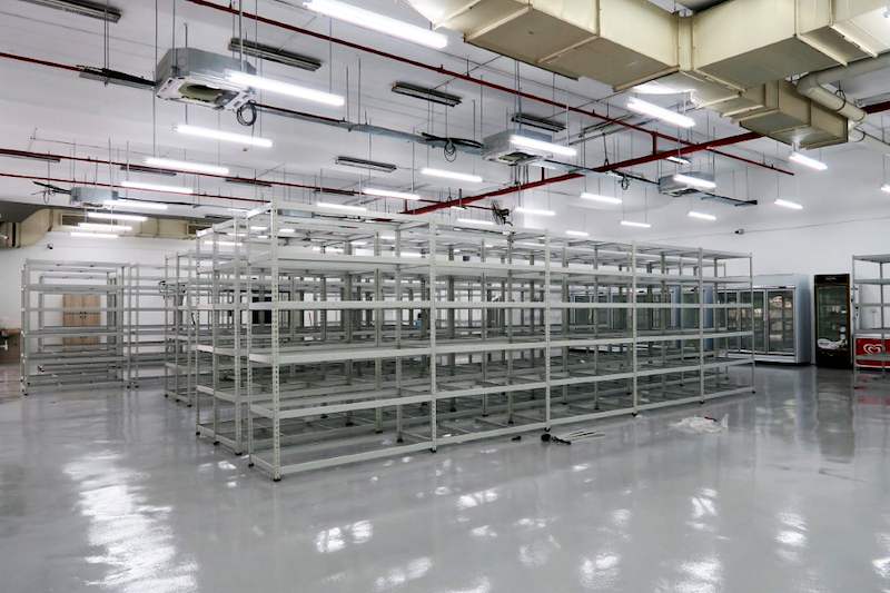 Boltless shelving blocks in the centre of the unit with glass-door chillers along the wall - Boltless Racking - B7 | Wong Lye Racking, Singapore Racking Manufacturer