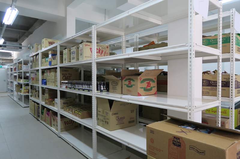 White boltless shelving with cartons of packaged goods on the shelves - Boltless Racking - B6 | Wong Lye Racking, Singapore Racking Manufacturer