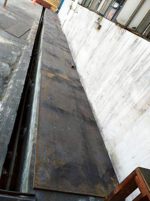 Long steel base plate laid along the concrete kerb before the uprights go up - V5000 Racking - V5-1 | Wong Lye Racking, Singapore Racking Manufacturer