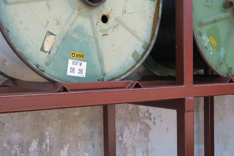 Cable drum sitting in a steel cradle beam on the upper tier - V5000 Racking - V5-1 | Wong Lye Racking, Singapore Racking Manufacturer