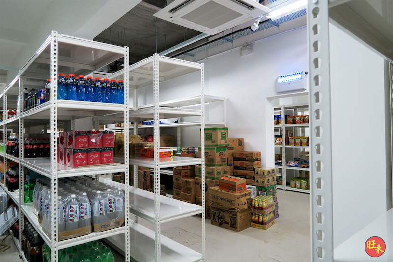 White boltless shelving units holding bottled drinks, cartons of stock beyond - Boltless Racking - B6 | Wong Lye Racking, Singapore Racking Manufacturer
