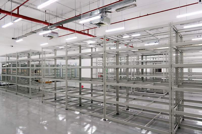 Rows of beige boltless shelving with steel shelves across the unit, all empty - Boltless Racking - B7 | Wong Lye Racking, Singapore Racking Manufacturer