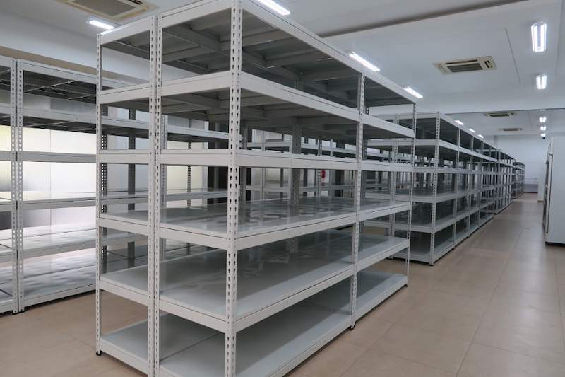 Rows of boltless shelving running the length of the room, viewed along an aisle - Boltless Racking - B5 | Wong Lye Racking, Singapore Racking Manufacturer