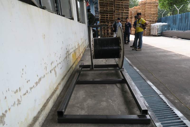Steel base frame laid along the wall with a cable drum test-fitted at the far end - V5000 Racking - V5-1 | Wong Lye Racking, Singapore Racking Manufacturer