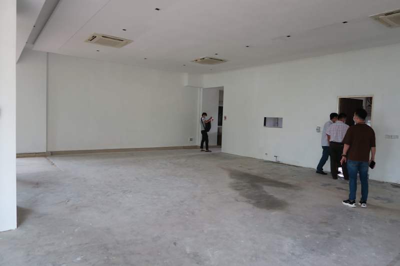 Before: empty room with bare concrete floor and doorways before the shelving was installed - Boltless Racking - B5 | Wong Lye Racking, Singapore Racking Manufacturer