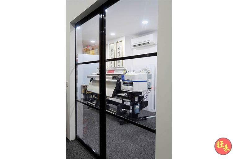 Glass-partitioned office room under the mezzanine with a printer and air-conditioning unit - V5000 Racking - V5-13 | Wong Lye Racking, Singapore Racking Manufacturer