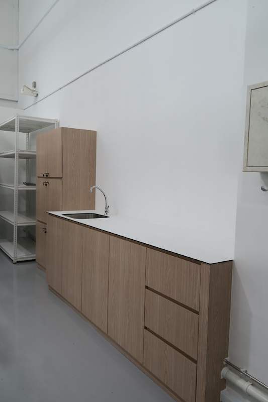Pantry counter with sink and tall cabinets along the wall next to the boltless shelving - Boltless Racking - B8 | Wong Lye Racking, Singapore Racking Manufacturer