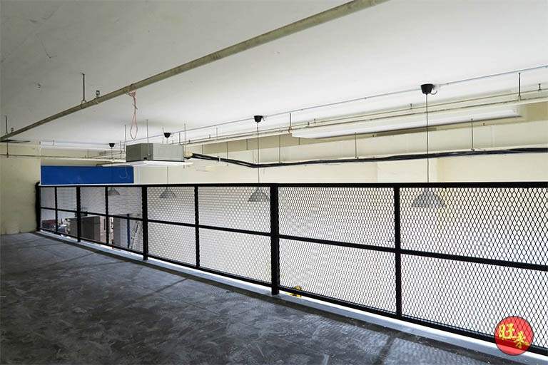Upper mezzanine deck with a black mesh safety railing along the edge, floor still empty - V5000 Racking - V5-13 | Wong Lye Racking, Singapore Racking Manufacturer