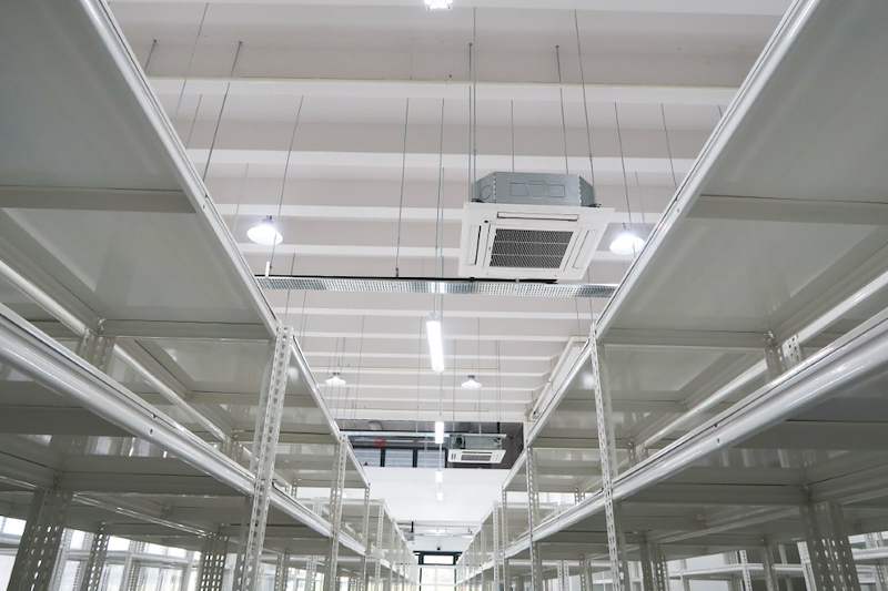 White boltless shelving rows with top shelves near the ceiling air-conditioning units - Boltless Racking - B8 | Wong Lye Racking, Singapore Racking Manufacturer