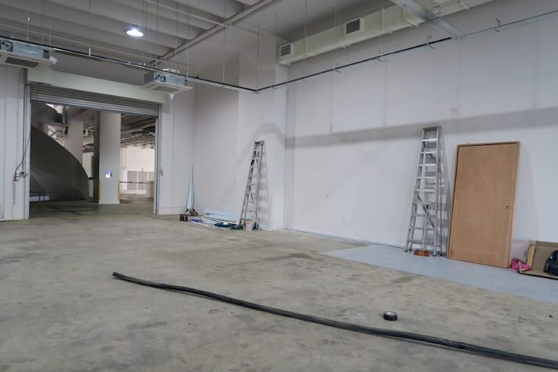 Before: unit interior looking toward the roller shutter, floor bare concrete - Boltless Racking - B8 | Wong Lye Racking, Singapore Racking Manufacturer