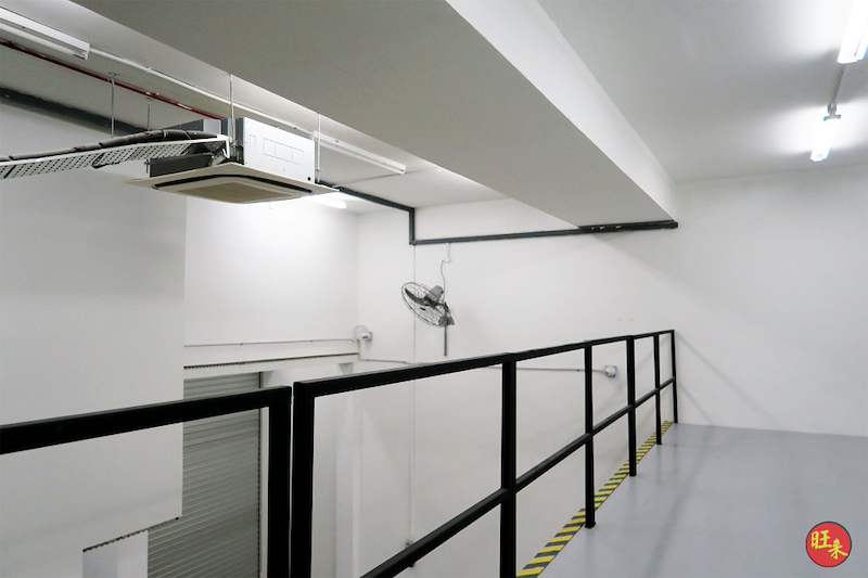 Mezzanine upper deck with black railing and a hazard-striped edge, viewed from the top of the staircase - V8000 Racking - V8-6 | Wong Lye Racking, Singapore Racking Manufacturer