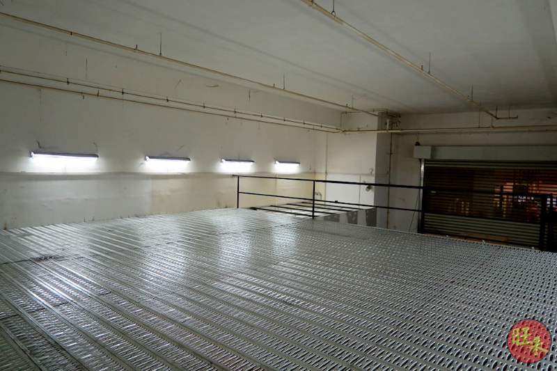 Upper mezzanine deck with grey perforated steel decking and black edge railing, not yet stocked - V6000 Racking - V6-7 | Wong Lye Racking, Singapore Racking Manufacturer