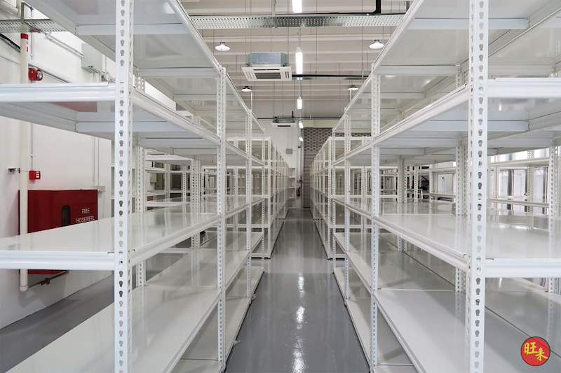 After: long aisle between rows of white boltless shelving on the finished epoxy floor - Boltless Racking - B8 | Wong Lye Racking, Singapore Racking Manufacturer