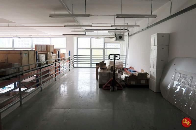 Upper mezzanine deck with tubular railing, pallet truck and cartons on the floor, pallet racking along one side - V5000 Racking - V5-19 | Wong Lye Racking, Singapore Racking Manufacturer