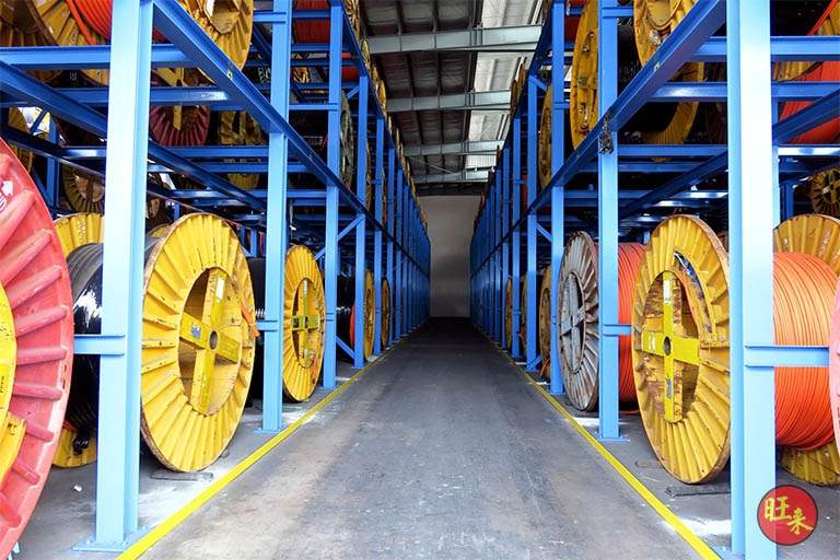 Aisle between V10000 racking runs with cable drums stacked on both sides - V10000 Racking - V10-1 | Wong Lye Racking, Singapore Racking Manufacturer