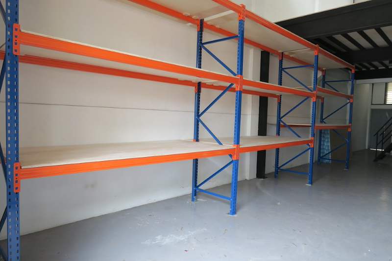 Long run of V3000 racking with plywood decking, mezzanine floor and staircase at the far end - V3000 Racking - V3-2 | Wong Lye Racking, Singapore Racking Manufacturer