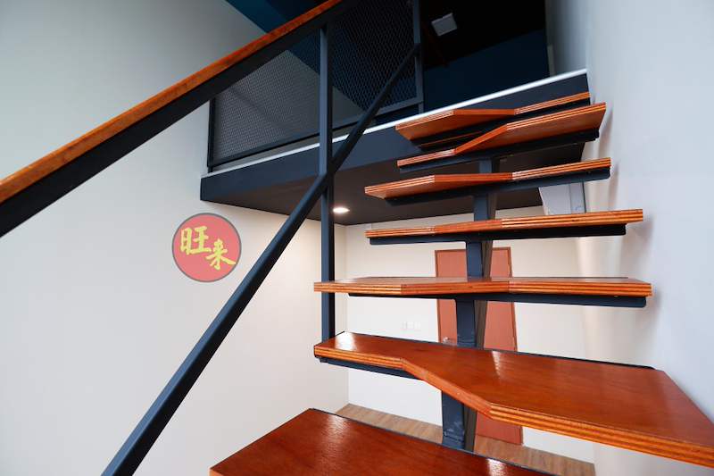 Close view of the timber stair treads on a central steel stringer below the loft - V5000 Racking - V5-26 | Wong Lye Racking, Singapore Racking Manufacturer