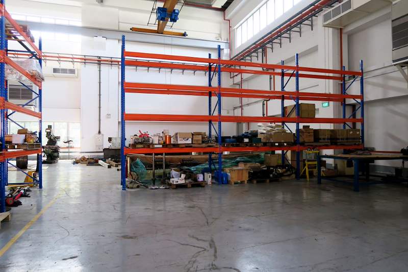 Wide view of V3000 racking runs across the workshop with parts on the lower levels - V3000 Racking - V3-5 | Wong Lye Racking, Singapore Racking Manufacturer