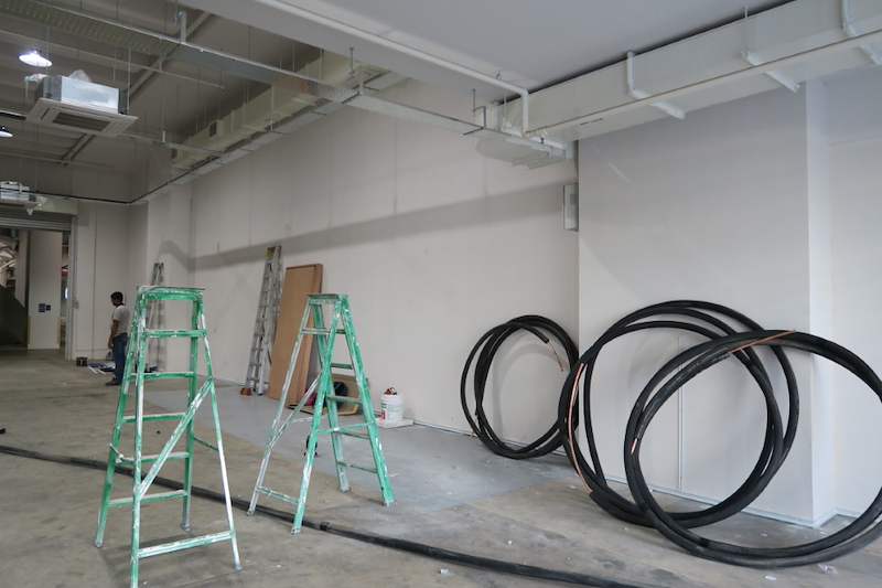 Before: ladders and coils of cable on the bare concrete floor - Boltless Racking - B8 | Wong Lye Racking, Singapore Racking Manufacturer