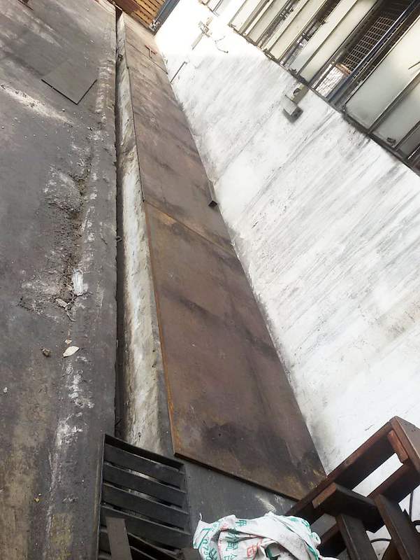 Steel base plate along the concrete kerb before the rack frame is erected - V5000 Racking - V5-1 | Wong Lye Racking, Singapore Racking Manufacturer