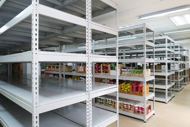 Boltless shelving bays stocked with bagged snacks and canned goods - Boltless Racking - B2 | Wong Lye Racking, Singapore Racking Manufacturer
