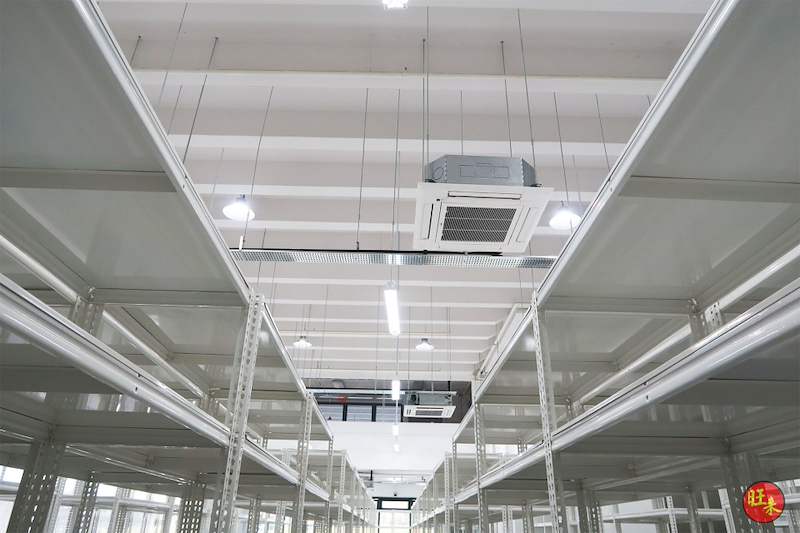 Looking up between rows of white boltless shelving to the ceiling cassette air-conditioning unit - Boltless Racking - B8 | Wong Lye Racking, Singapore Racking Manufacturer