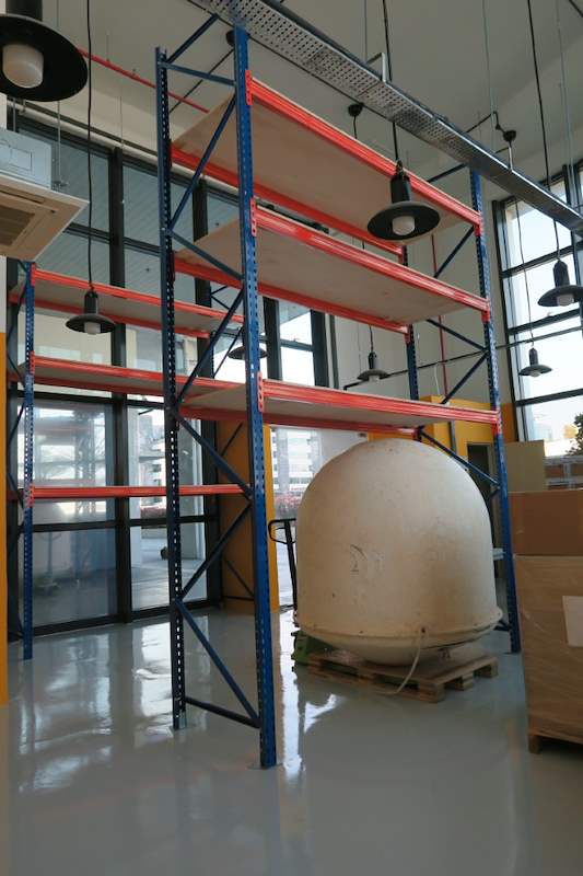 Blue-and-orange V3000 racking with plywood decking beside an orange partition, viewed from the side - V3000 Racking - V3-4 | Wong Lye Racking, Singapore Racking Manufacturer