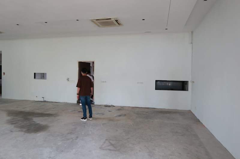 Before: bare room with concrete floor and a doorway, prior to fitting the shelving - Boltless Racking - B5 | Wong Lye Racking, Singapore Racking Manufacturer