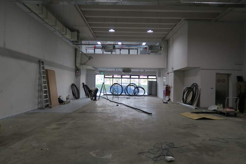 Before: bare unit with concrete floor, coils of cable and a ladder before the shelving was installed - Boltless Racking - B8 | Wong Lye Racking, Singapore Racking Manufacturer