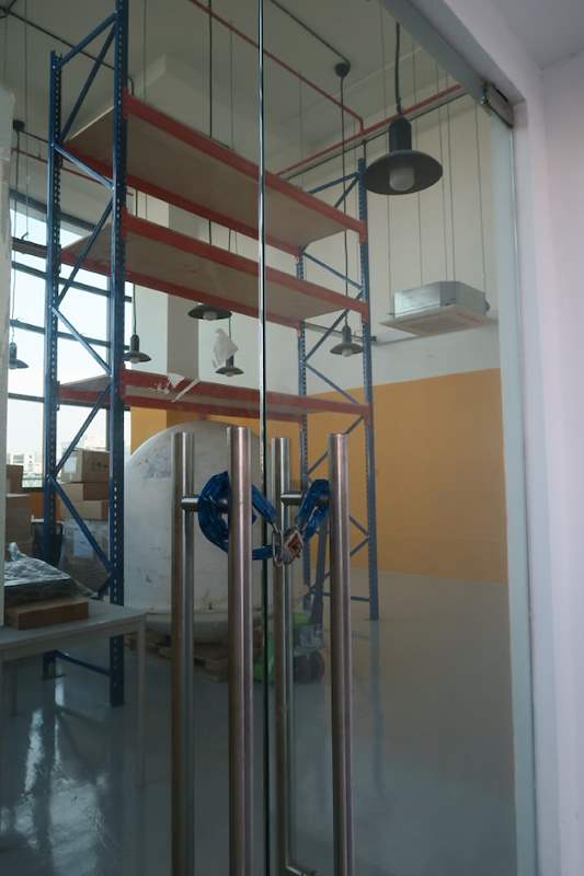 V3000 racking bay seen through the glass partition of the adjoining room - V3000 Racking - V3-4 | Wong Lye Racking, Singapore Racking Manufacturer