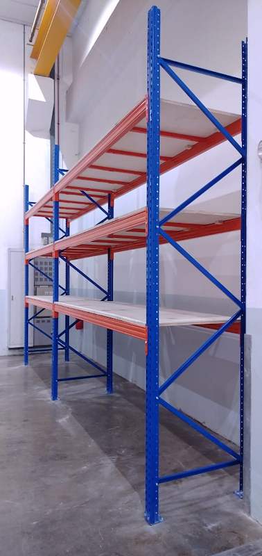 End view of a V3000 racking bay with three plywood-decked levels, blue frame bracing visible - V3000 Racking - V3-1 | Wong Lye Racking, Singapore Racking Manufacturer