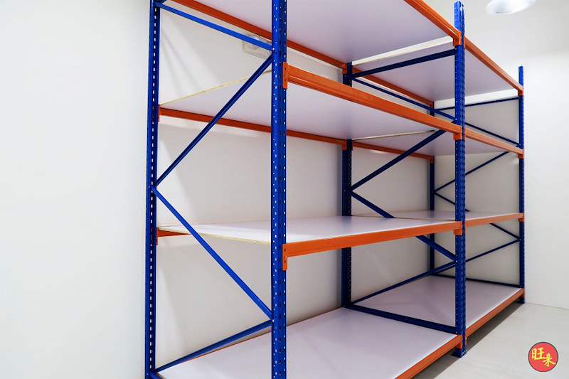 Two bays of long-span racking with blue uprights, orange beams and white decking, empty - Boltless Racking - B3 | Wong Lye Racking, Singapore Racking Manufacturer