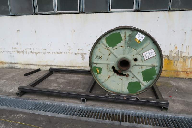 Cable drum on its side on a welded steel base frame along the wall, a trial fit before the rack goes up - V5000 Racking - V5-1 | Wong Lye Racking, Singapore Racking Manufacturer