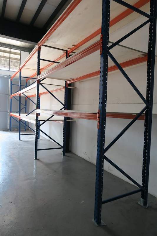 Three orange beam levels with plywood decking on blue uprights, bays empty - V3000 Racking - V3-2 | Wong Lye Racking, Singapore Racking Manufacturer