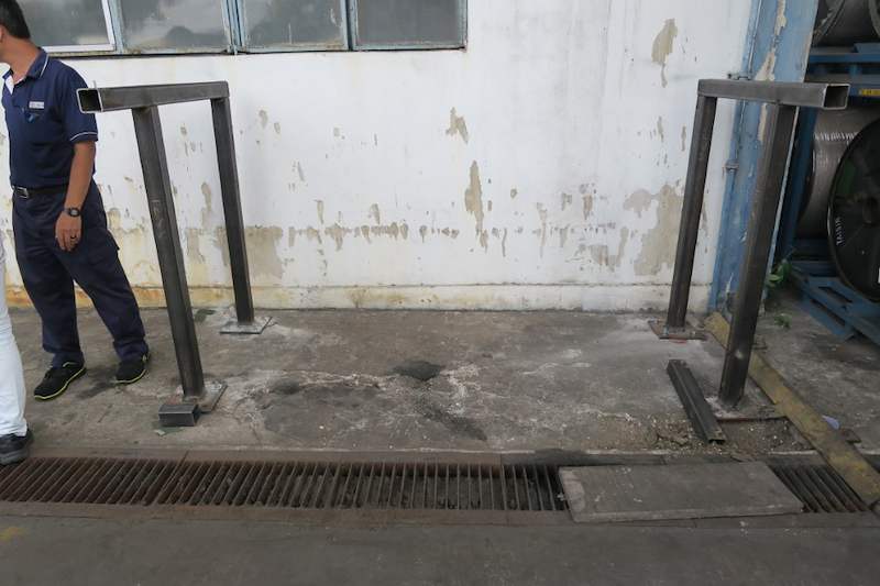 Two steel upright frames fixed to the floor along the wall, awaiting the connecting beams - V5000 Racking - V5-1 | Wong Lye Racking, Singapore Racking Manufacturer