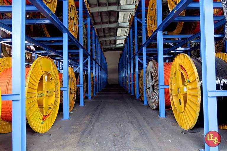 Narrow aisle between two runs of V10000 racking loaded with cable drums - V10000 Racking - V10-1 | Wong Lye Racking, Singapore Racking Manufacturer