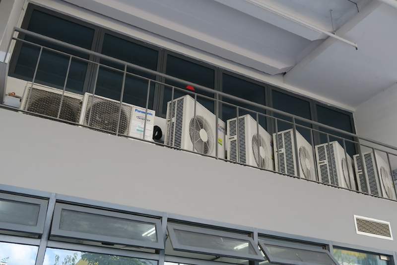 Condenser units on the high ledge with the window wall below - Boltless Racking - B8 | Wong Lye Racking, Singapore Racking Manufacturer