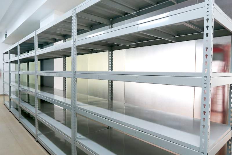 Close view of a boltless shelving bay showing the slotted uprights and steel shelf panels - Boltless Racking - B5 | Wong Lye Racking, Singapore Racking Manufacturer